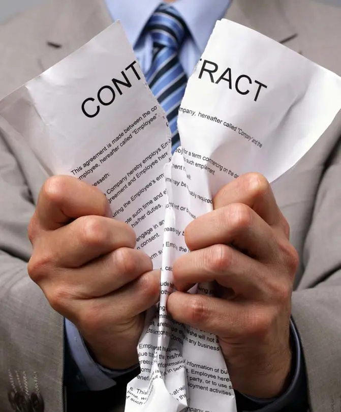 A-businessman-tearing-a-contract-or-agreement-paper