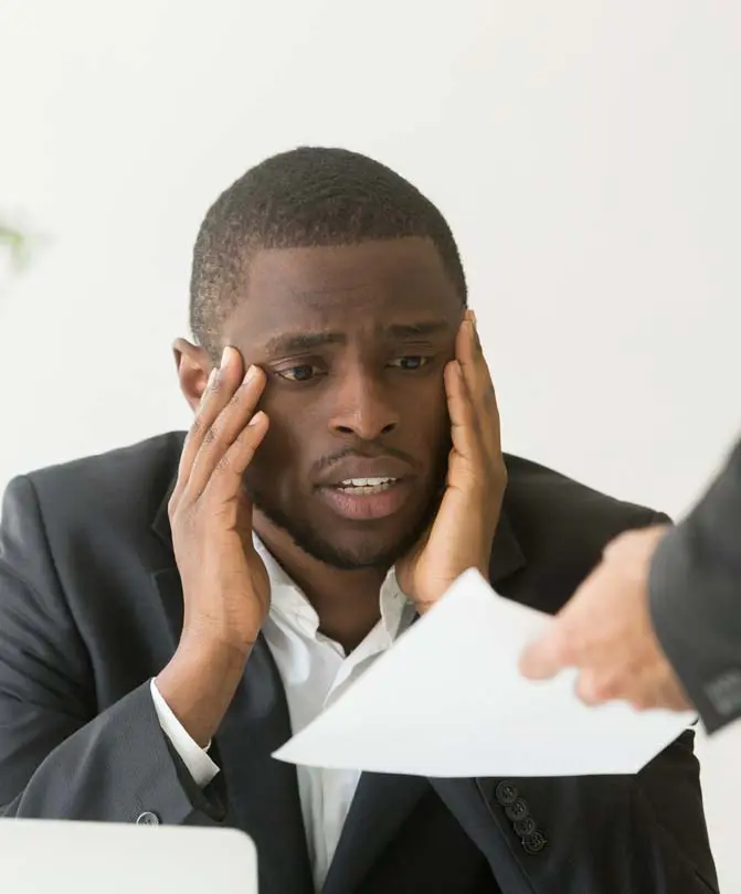 Frustrated-African-American-worker-getting-notice