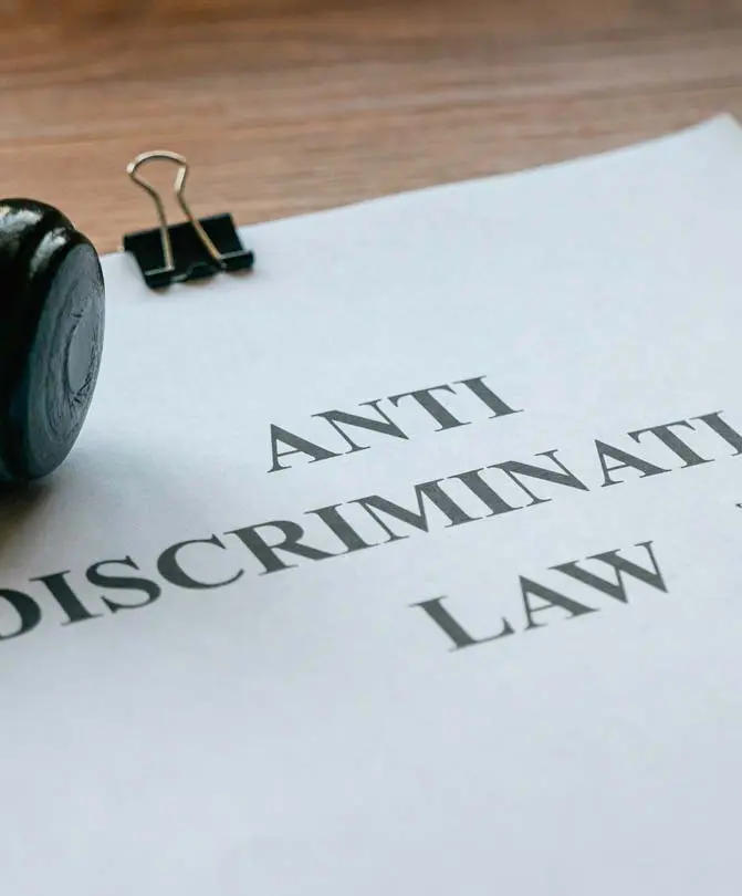 Gavel-with-anti-discrimination-law-paperwork