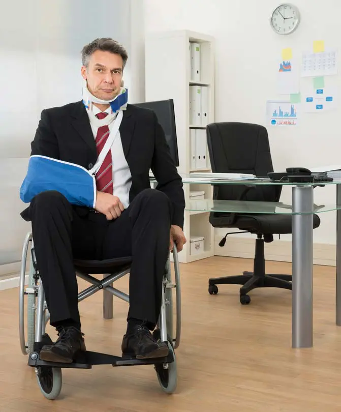 Image-of-handicapped-businessman-sitting-on-wheelchair-in-office