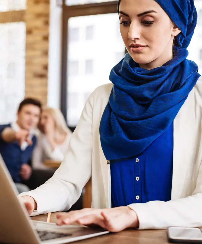 Woman-with-head-covering-working-on-computer