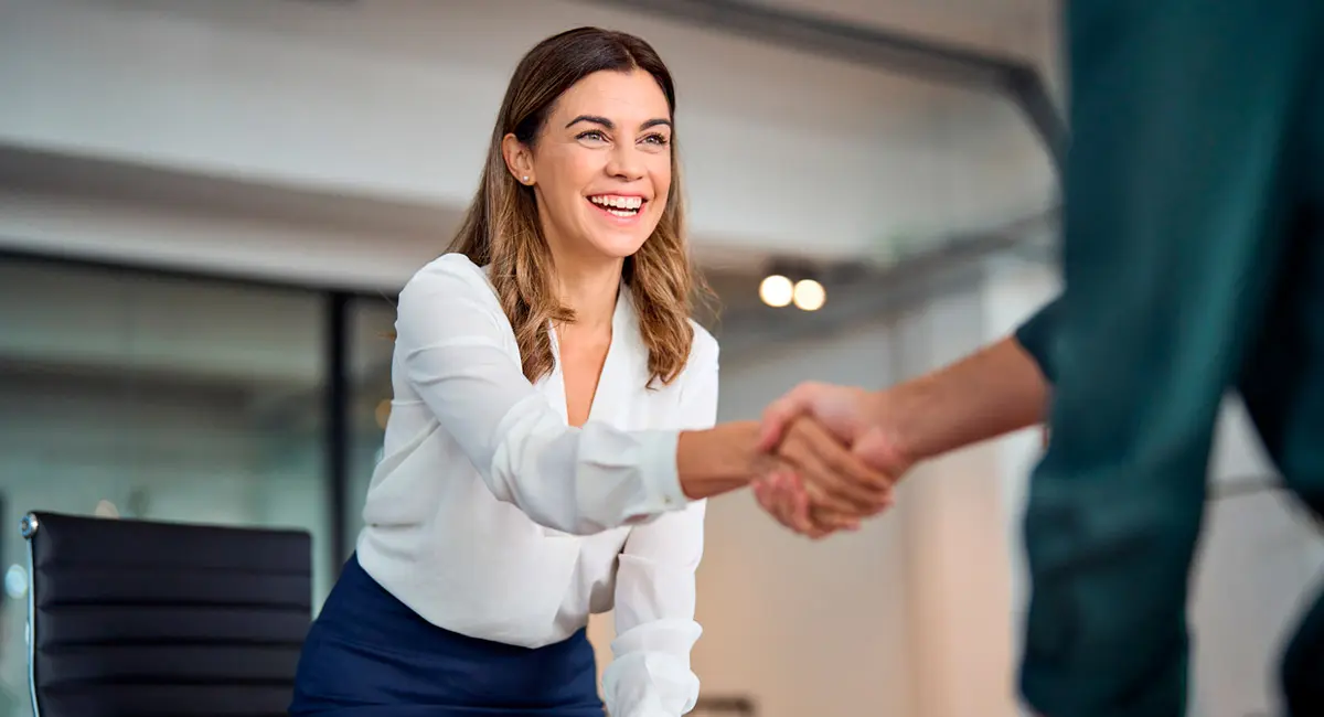 attorney-standing-up-to-shake-client's-hand
