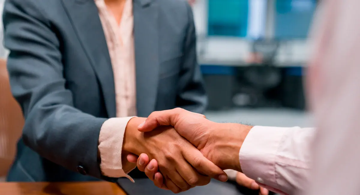 client shaking lawyer's hand