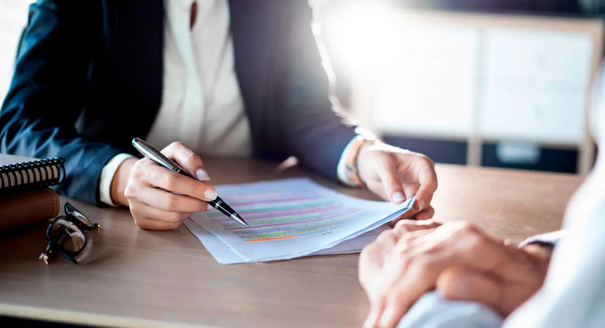 lawyer explaining paperwork to client