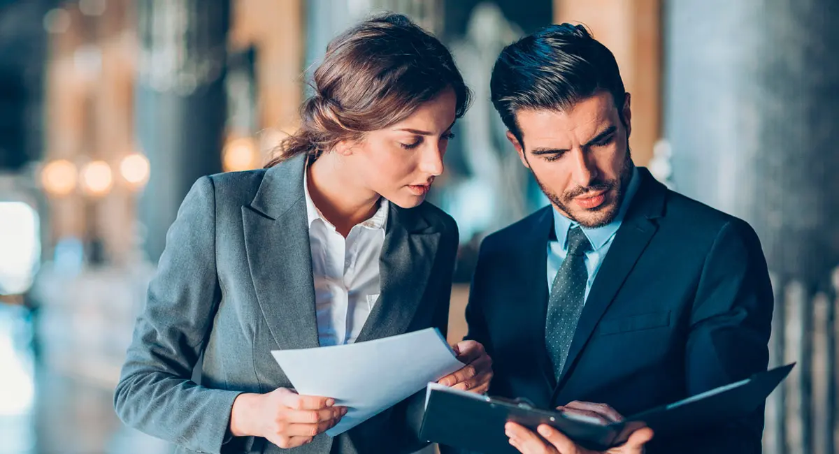 two attorneys looking at case paperwork