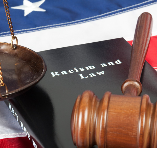 Book-about-racism-with-a-gavel-and-American-flag Book-about-racism-with-a-gavel-and-American-flag
