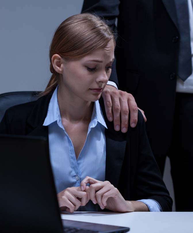 Boss-touching-female-worker's-shoulder Boss-touching-female-worker's-shoulder