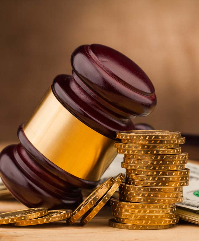 Judge-gavel-alongside-currency Judge-gavel-alongside-currency