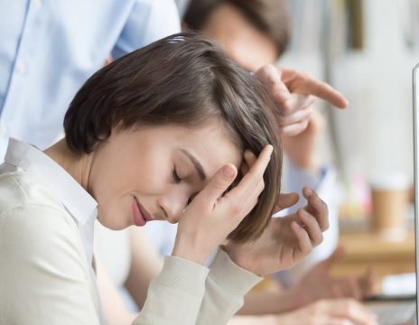 Company-manager-reprimanding-female-employee