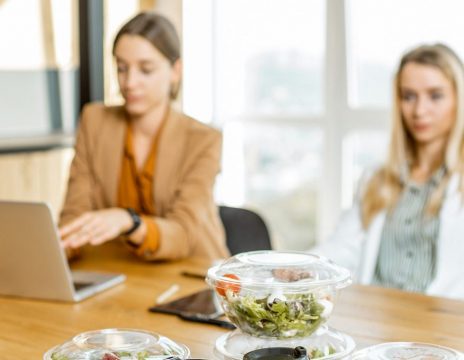 Office-employees-with-healthy-takeaway-food-indoors