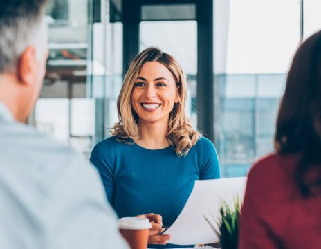 attorney smiling at couple during consultation