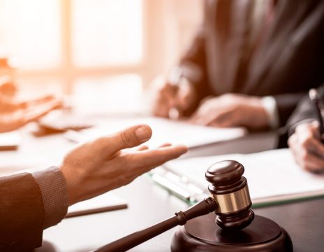 attorneys discussing case paperwork