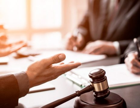 attorneys discussing case paperwork