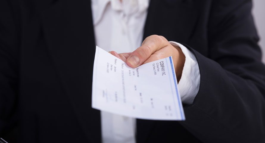 boss-holding-out-payroll-check
