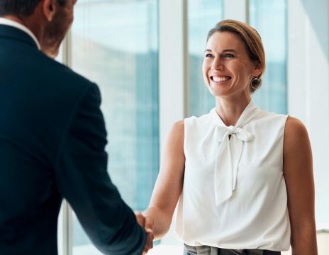 client shaking attorney's hand in office
