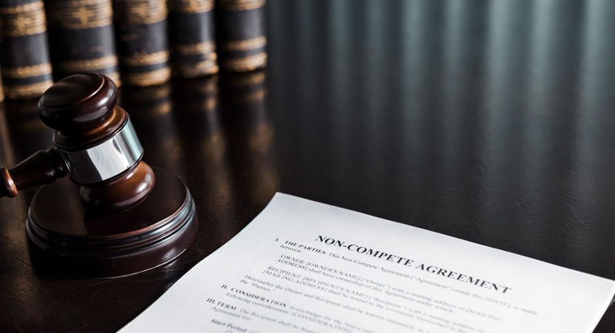 gavel-resting-beside-a-legal-document-in-front-of-law-books