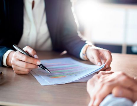 lawyer explaining paperwork to client