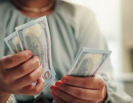 person-counting-cash-at-a-table
