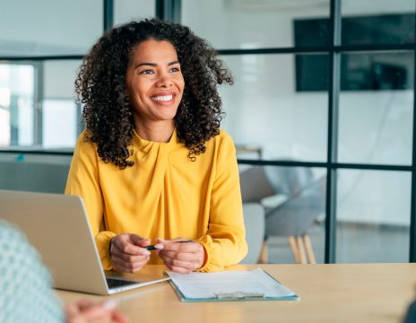 smiling attorney in meeting with legal team