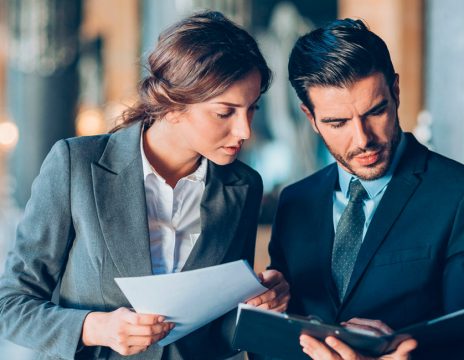 two attorneys looking at case paperwork